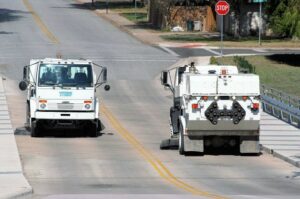 Two More Clean sweepers passing while performing street sweeping duties.