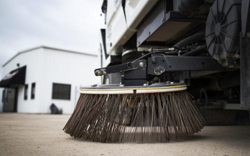 Close up of Gutter Broom on a sweeper truck