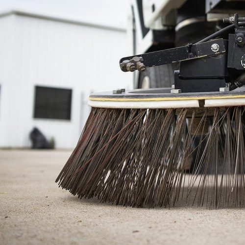 Close up of sweeper broom on a sweeper truck